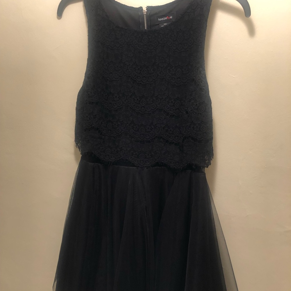 Black dress with sheer middle.